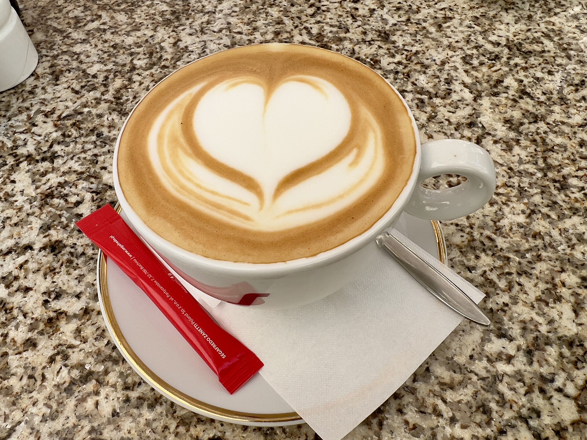 A flat white with heart-shaped latte art