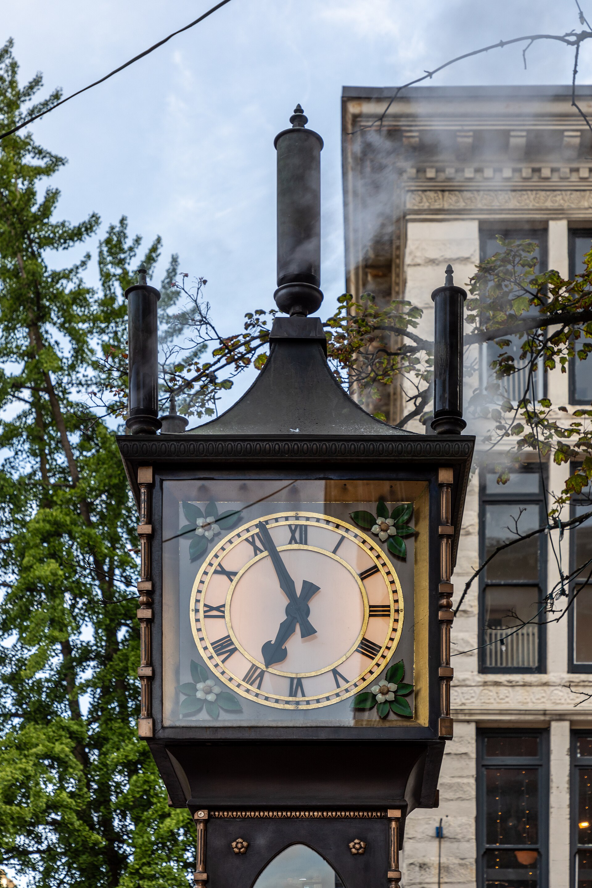 The Gastown steam clock with steam rising behind it